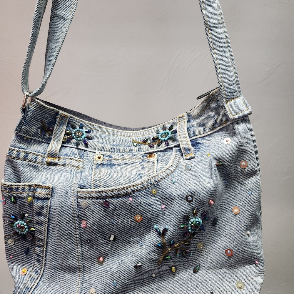 Denim handbag made from recycled jeans light denim colored with bead flowers.